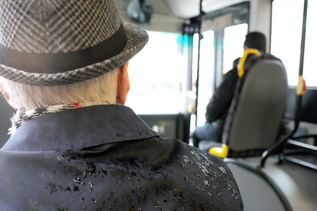 man-wearing-black-coat-while-wet-126686 Brezplačen prevoz za upokojence